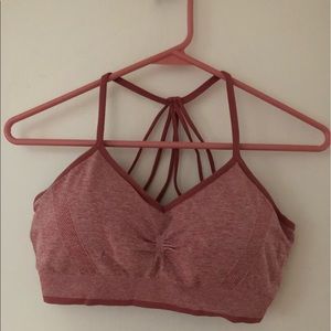 Sports bra with cup pads. brand new, tried on but never worn.